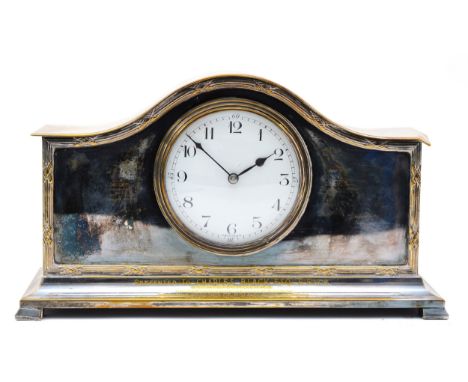 A 1920s French silver plated mantel clock, having enamelled dial with Roman numerals, the 8 day movement stamped France, 15cm