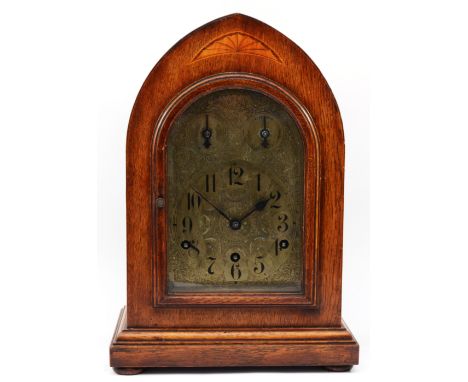 A late 19th century German mahogany bracket clock, the 5" chased brass arched dial stamped Germany, with strike/silent to the