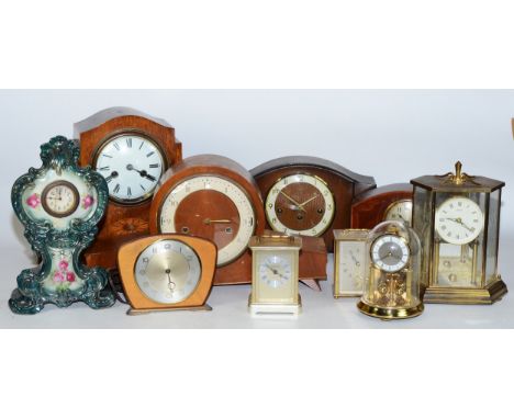 A collection of early 20th century and later clocks, to include mantel, carriage, traveling and others, having manual wind an
