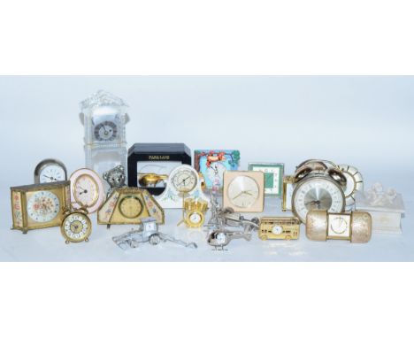 A collection of miniature novelty clocks, together with traveling alarm clocks, having manual and quartz movements. 