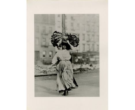 Artist: Lewis Hine (American, 1874-1940). Title: "Italian Immigrant Woman Carrying Home Garments, Lower East Side, New York".