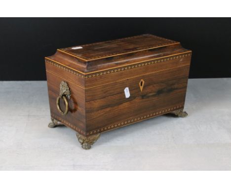 Regency Rosewood and Parquetry Satinwood Inlaid Tea Caddy of sarcophagus form, the hinged lid opening to two lidded tea compa