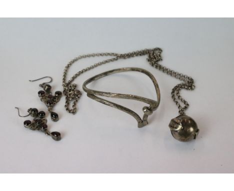 A small collection of silver jewellery to include a ball locket, bangle and earrings. 