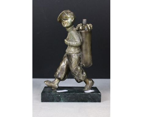In the manner of Josef Lorenzl, Art Deco Table Lighter in the form of a Young Golf Caddy, raised on a marble base, 20cm high