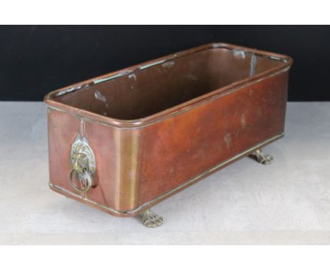 Copper Rectangular Planter with lion head drop ring handles and brass lion paw feet 