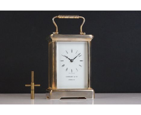 A brass cased carriage clock with bevelled glass panels, Garrard &amp; Co. London. 