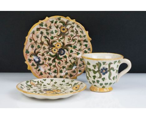 Della Robbia Pottery (Birkenhead 1894-1906) Cup and Saucer with painted floral decoration in shades of green, blue and yellow