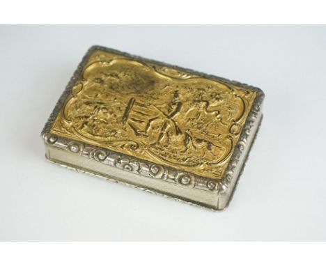 An antique ornate silver gilt snuff box with repousse decoration to lid of a hunting scene. 