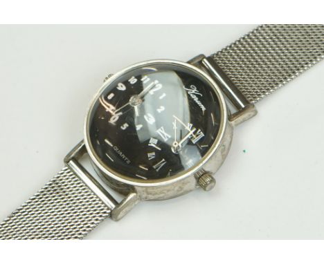 A collection of gents wristwatches to include Rotary, Casio and Bulova examples contained within a display case. 