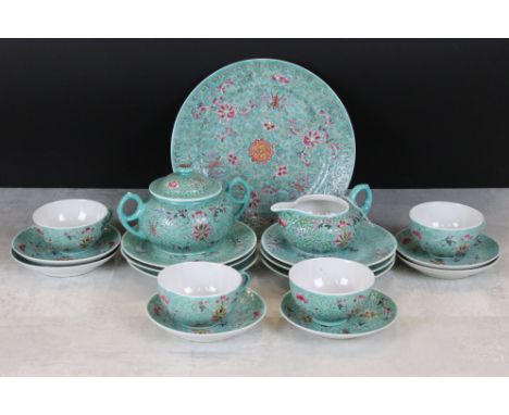 20th century Chinese Famille Rose part Tea Service with enamel decoration of flowers and symbols on a green ground comprising