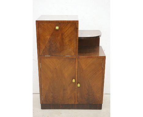 Art Deco Walnut Stepped Cocktail Cabinet with geometric veneer decoration to front of doors and green bakelite handles compri