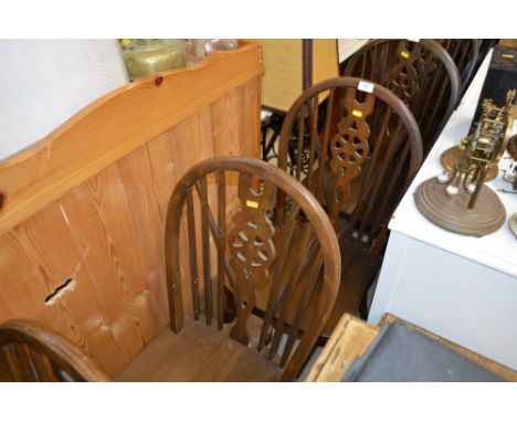A set of four stick and wheel back kitchen chairs 