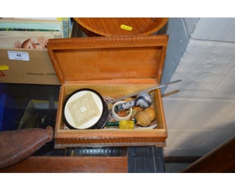 A carved wooden box containing a snuff box, a Victorian mourning pin, a small boxwood rule etc. 