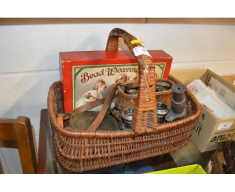A basket containing a barometer, binoculars, students microscope etc. 