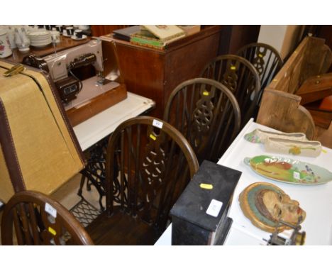 A set of four stick and wheel back kitchen chairs 
