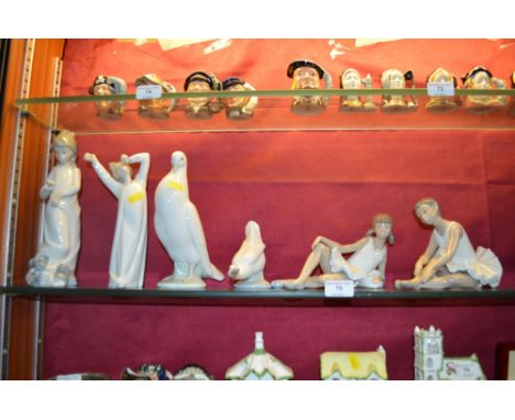 Two Nao figurines in the form of ballet dancers, a Nao goose and dove; a Lladro figure and one other similar 