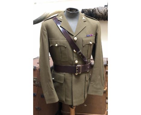 A British army Captains Royal Army Pay Corps No. 2 tunic and trousers and Mess Dress, together with an assortment of berets, 