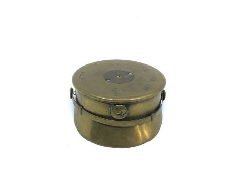A piece of WWI trench art in the form of a British army Trench cap, made from the shell casing of an 18 pounder and dated 191