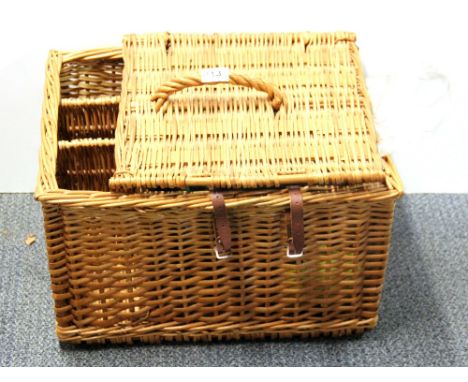 A vintage French picnic basket and picnic set.