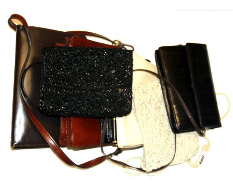A group of vintage lady's handbags.