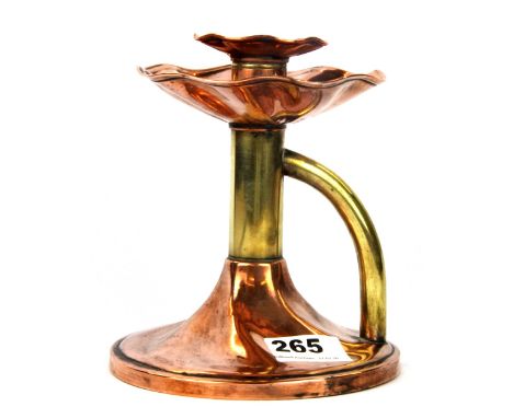 An Arts &amp; Crafts brass and copper chamber stick, H. 16cm.