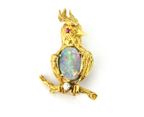 A yellow metal (tested 18ct gold) bird shaped brooch set with ruby eye, diamond and opal triplet, L. 3.6cm.