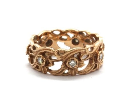 A boxed 14ct rose gold (stamped 14k) diamond set "The Welsh Gold Full Eternity Ring" by Stuart Devlin, with paperwork and cer