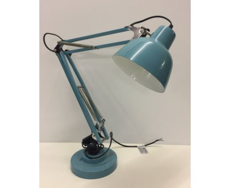 A modern blue angle poise lamp  