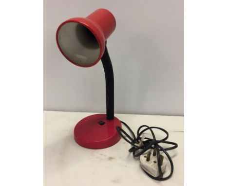 A c.1970's red plastic angle poise lamp.  