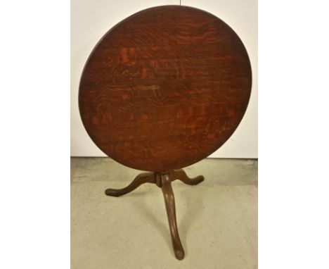 A mahogany tripod base tip top table with circular top.  Approx. 80cm diameter. 66cm tall when made as table.