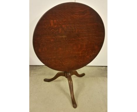 A mahogany tripod base tip top table with circular top.  Approx. 80cm diameter. 66cm tall when made as table.