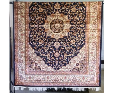 A large Keshan Carpet with blue coloured background design.  230cm x 160cm