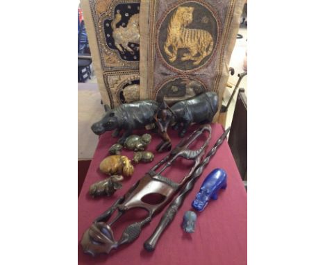 A box of assorted tribal & African items to include soapstone carvings, wooden mask & stick 