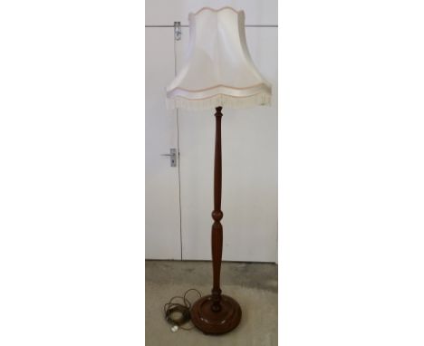 A vintage wooden standard lamp. With cream shade. 