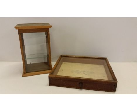 2 vintage wooden cased table top display cabinets. One with small internal glass shelf, the other with pull out drawer. 1. ap