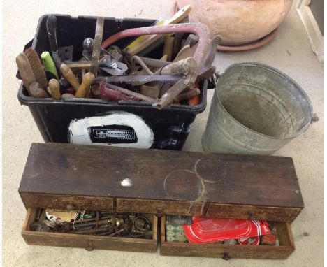A quantity of old tools comprising a box of assorted tools, a galvanised bucket, and a 5 drawer wooden tool chest with conten