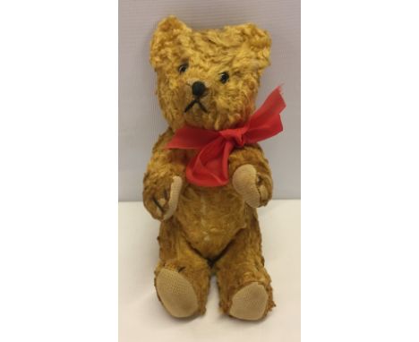 Small vintage Eastern European cotton plush teddy Bear. Glass eyes. Fully jointed. Measures Approx 21cm tall. 