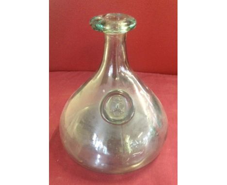A green glass ship's decanter with Viking head boss  