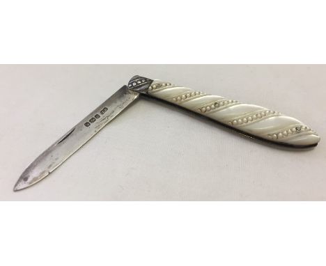 A silver bladed fruit knife with Mother of Pearl handle. Blade hallmarked Sheffield 1899 Approx. 8cm long when closed.