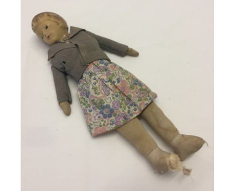 A c1920-30s doll. Ceramic head & soft body. 10" tall. 