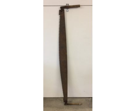 A vintage two handled saw.  