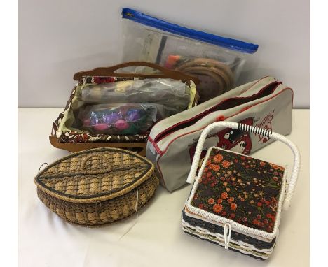 A box of sewing baskets and tapestry items. To include yarns and frames. 