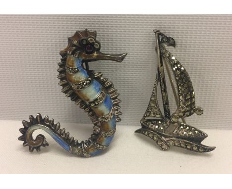 An enamel & marcasite seahorse brooch together with a marcasite yacht brooch  