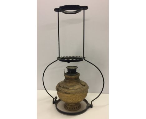 A vintage suspended oil lamp  