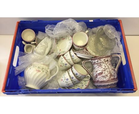 A Johnson brothers floral pattern tea service. Comprising 10 cups, 16 saucers, 5 bowls, a teapot, sugar bowl and milk jug. 