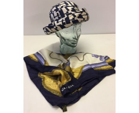 A vintage Jaeger blue & ivory ladies hat together with a vintage Jaeger silk scarf. Scarf is blue, ivory and gold colours. 