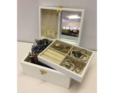 A white wooden vintage jewellery box with floral decoration. Containing costume jewellery. 