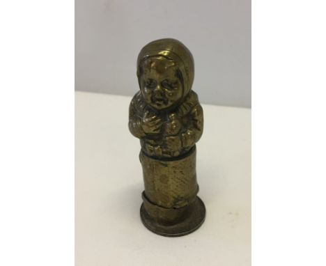 A c.WWI brass trench art lighter made from a shell/cartridge depicting a baby.  