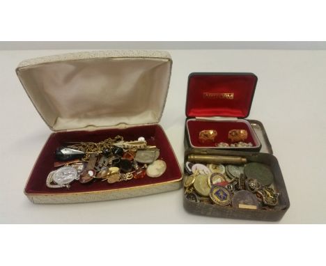 A box of assorted jewellery items to include pin badges, cufflinks and hat pins.  