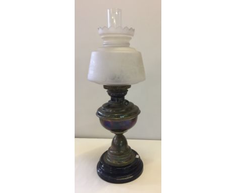 A vintage brass oil lamp on ceramic base. With white glass shade bird and blossom etching detail. Approx. 61cm tall (inc chim